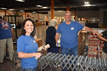 shippers group volunteers help pack commodity boxes at north texas food bank