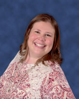 Headshot of TSG's Sarah Sheppard smiling