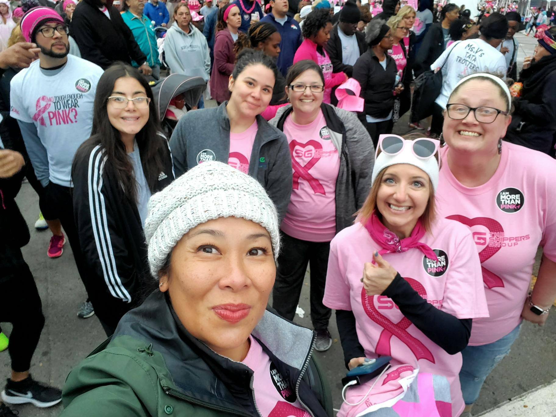 Several of The Shippers Group associates and family gather for a group selfie before the race