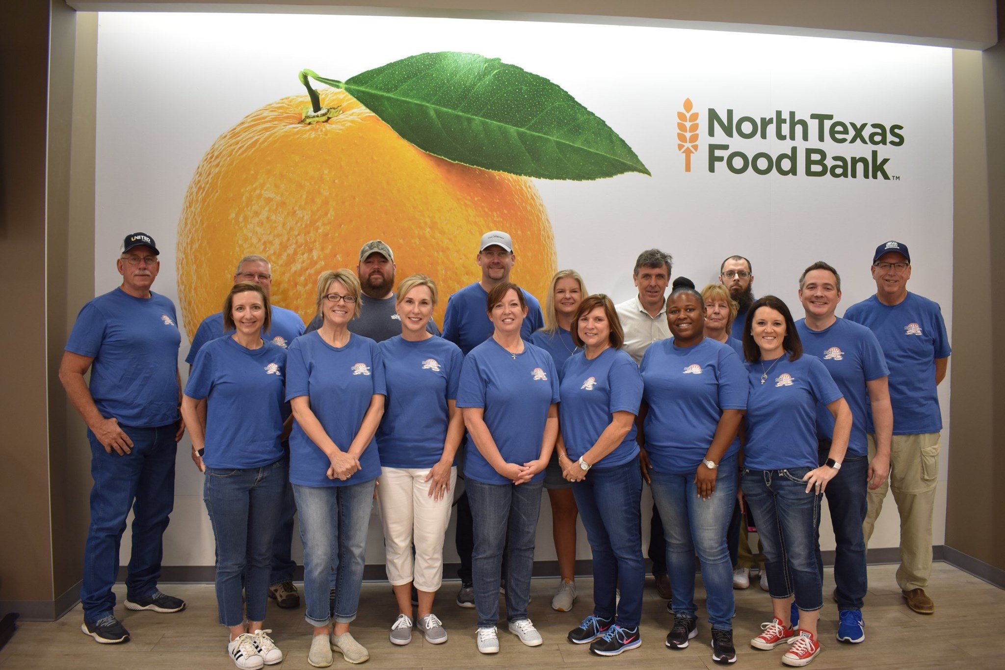 shippers group corporate associates volunteer to pack supplemental grocery boxes for seniors at north texas food bank