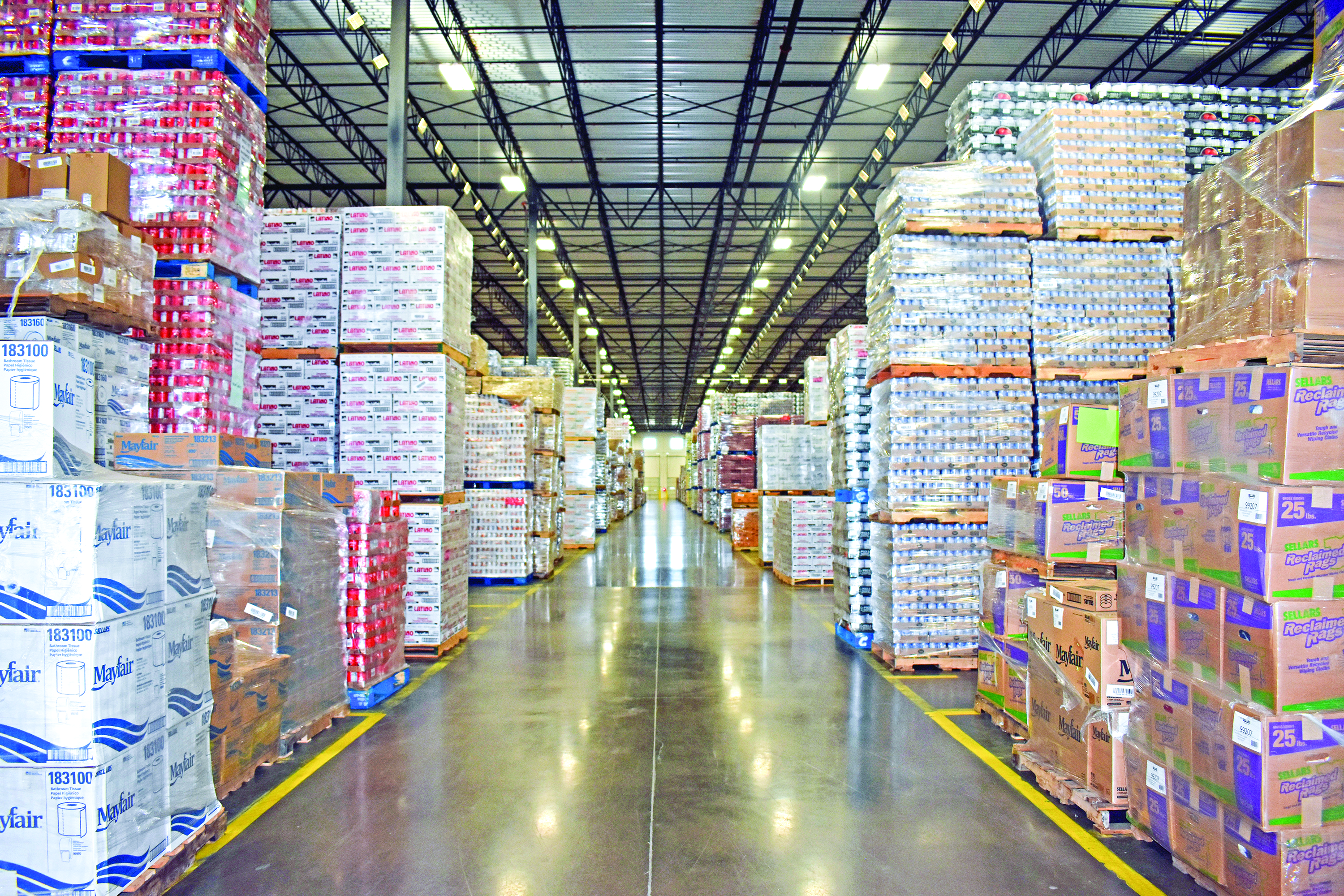 Aisle view of expansive 3PL warehouse full of a large inventory of product