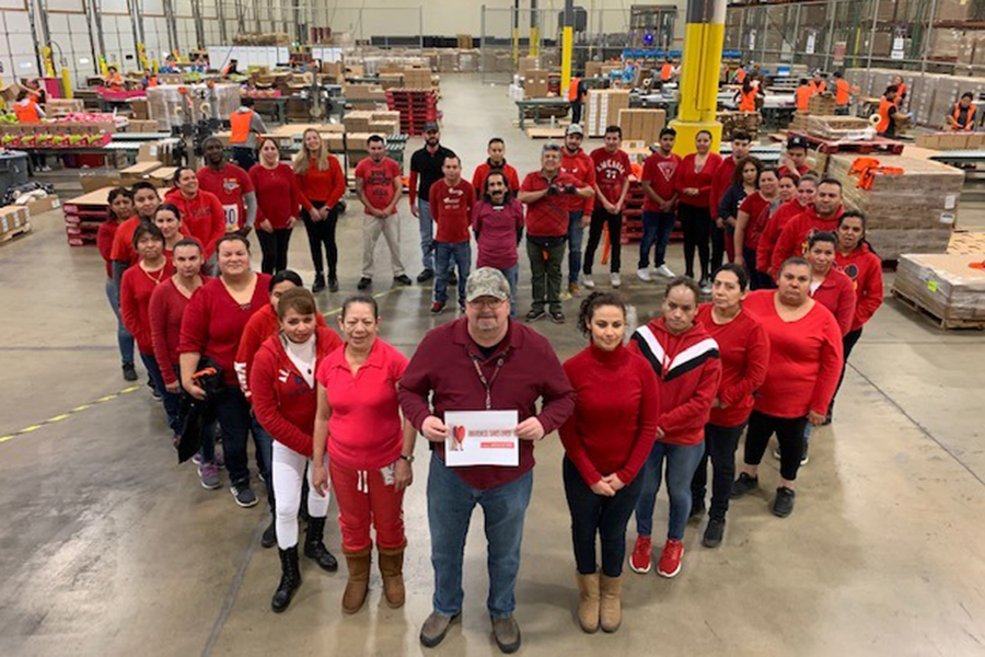 Bolingbrook associates wearing red shirts in the shape of a heart to recognize National Wear Red Day